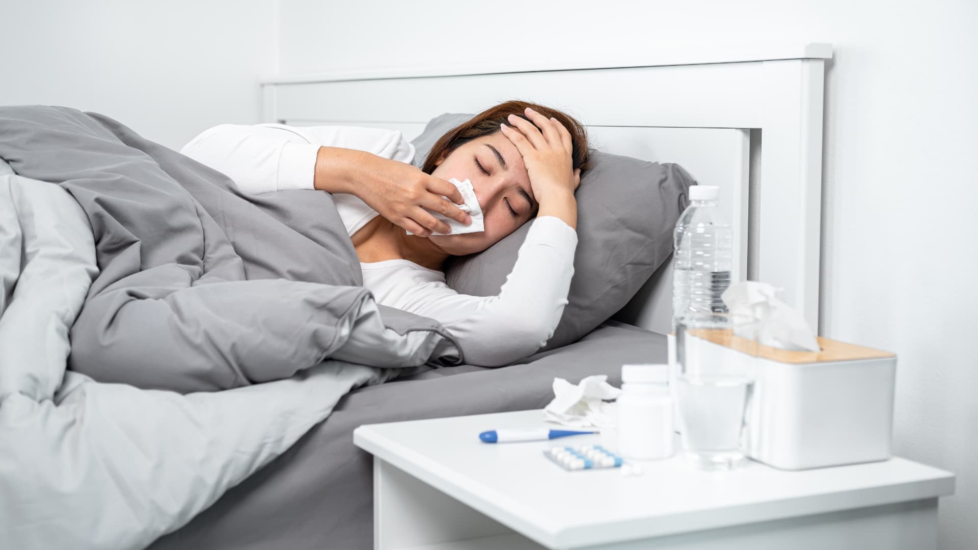 Tenant lying in bed with illness caused by toxic mold exposure